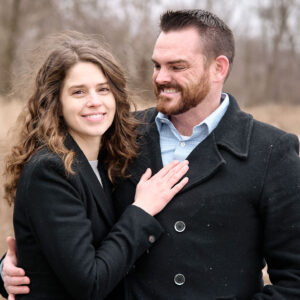 Portrait of Madison and John outside on a fall day.