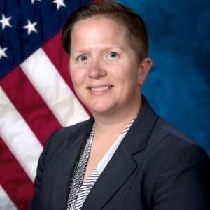 Portrait of CCWC's new President, Brigette S. Murray in front of an American flag.